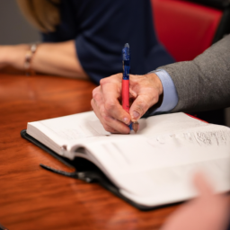 A business professional attentively listening to a client during a meeting.