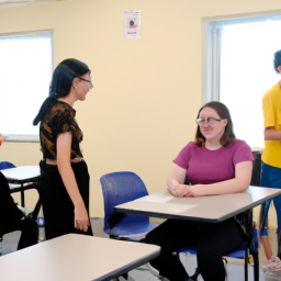 A classroom setting with students practicing English conversation in pairs.