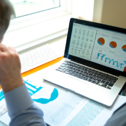 A financial analyst reviewing construction project budgets using ERP software.