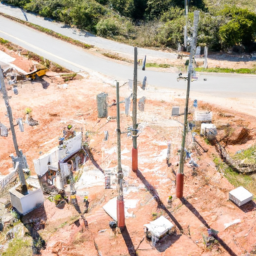Aerial view of a construction site with visible communication infrastructure.