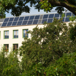 Aerial view of a sustainable building with solar panels and green roofing.