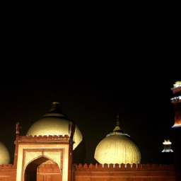 The historic Badshahi Mosque in Lahore, illuminated against the night sky, reflecting Mughal architectural grandeur.