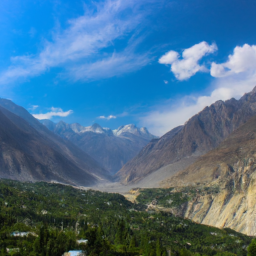 The serene landscape of Hunza Valley, with its lush greenery and snow-capped mountains in the background.